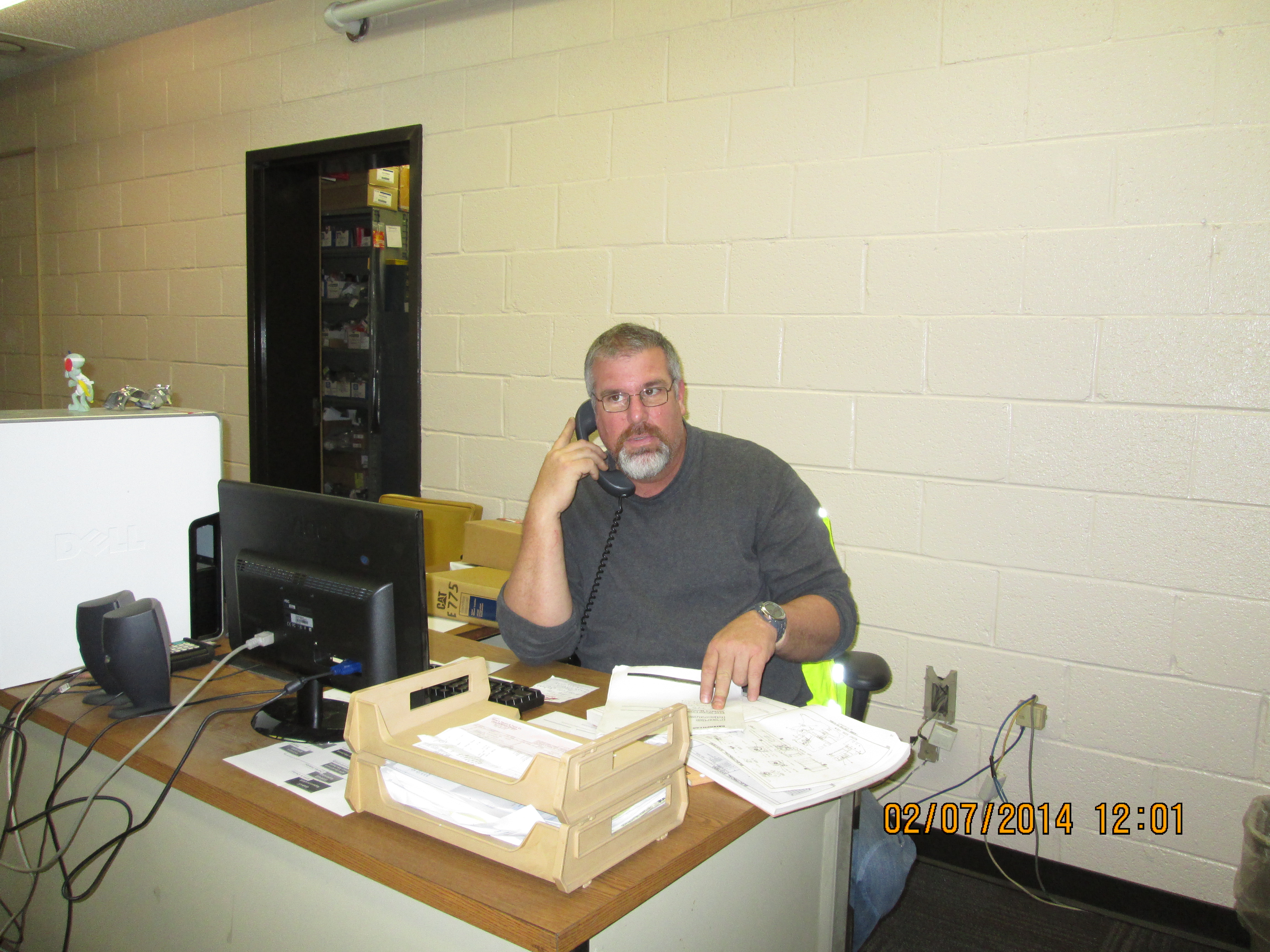 Garage Employee at Desk